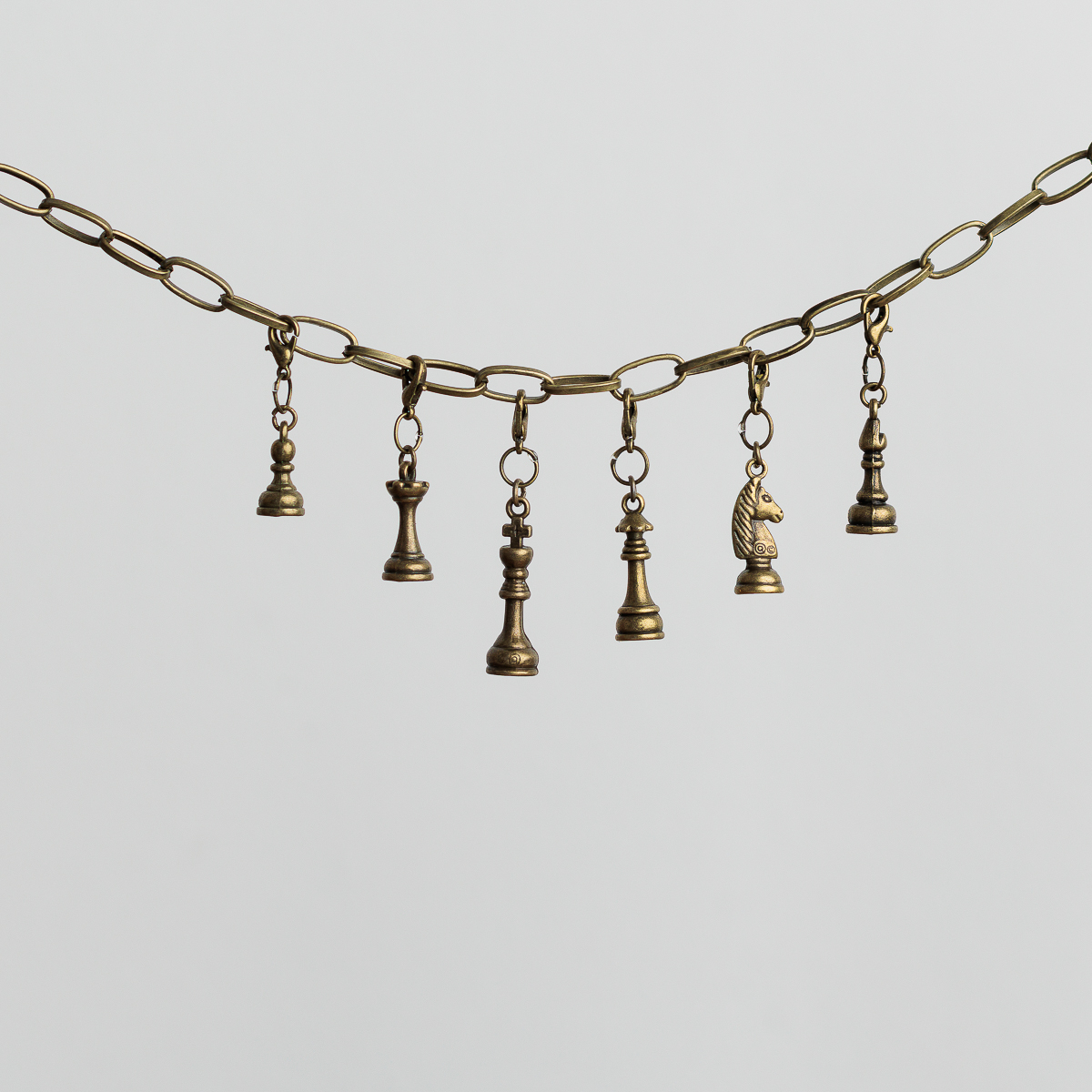 Chess piece belt baubles for game-loving costumes