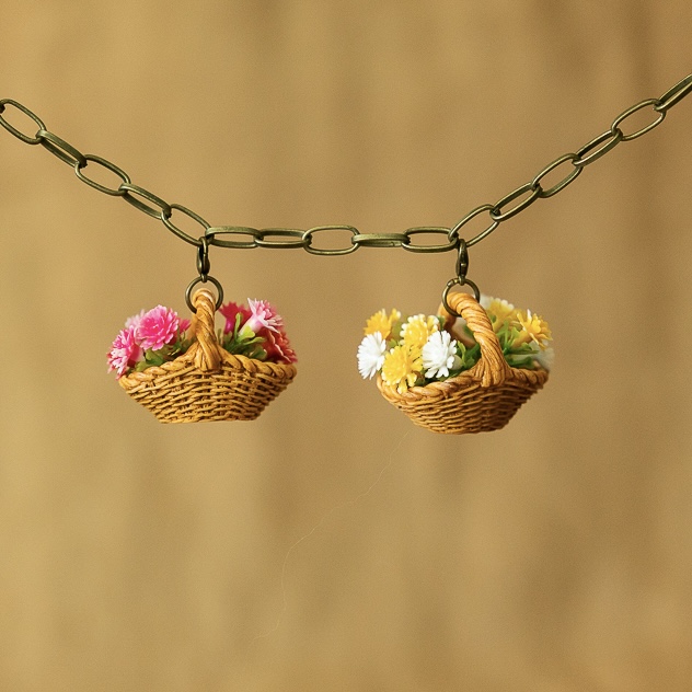 Pink and yellow baskets of flowers